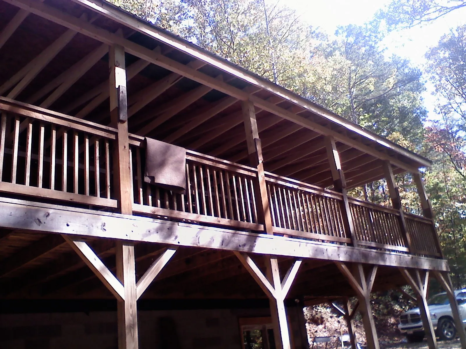 Timber framing under a new elevated porch and deck — Roof Leak Repair in Saginaw by Roofing Brothers